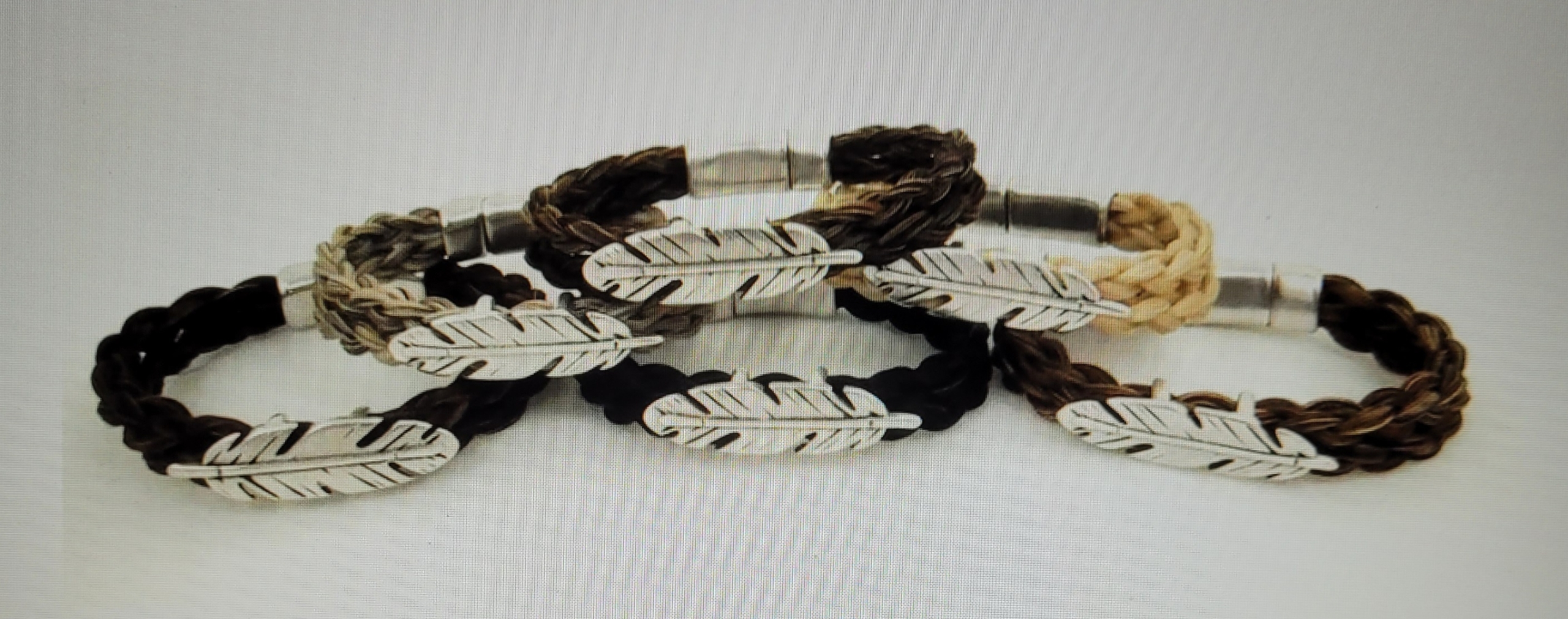 A Symbolic Feather on this Horse Hair Bracelet - Corolla Wild Horse Fund